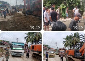Kapolsek Tanah Jawa Amankan Perbaikan Jalan di Huta II Buntu Sihaltong.