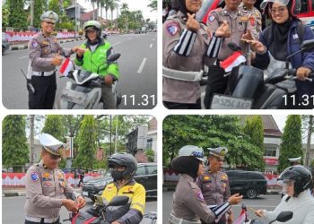 Sambut HUT RI Ke - 80, Polres Pematangsiantar Bagikan Bendera Merah Putih Kepada Pengendara.