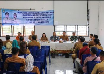 Wali Kota Pematangsiantar Wesly Silalahi, SH, MKn Diwakili Staf Ahli Bidang Pemerintahan Dra Happy Oikumenis Daely, Buka Musrenbang Kecamatan Siantar Marimbun.