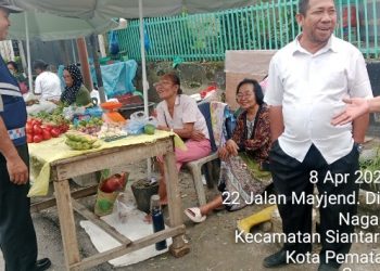 Bhabinkamtibmas Polsek Siantar Marihat Sambang Kamtibmas di Pasar Pagi.