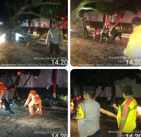 Polsek Siantar Martoba Bersihkan Pohon Tumbang Antisipasi Kemacetan Arus Lalin di Jalan Medan.