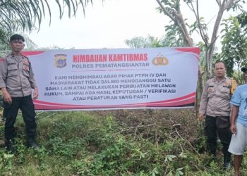 Polsek Siantar Martoba Pemasangan Spanduk Himbauan Kamtibmas di Gurilla.